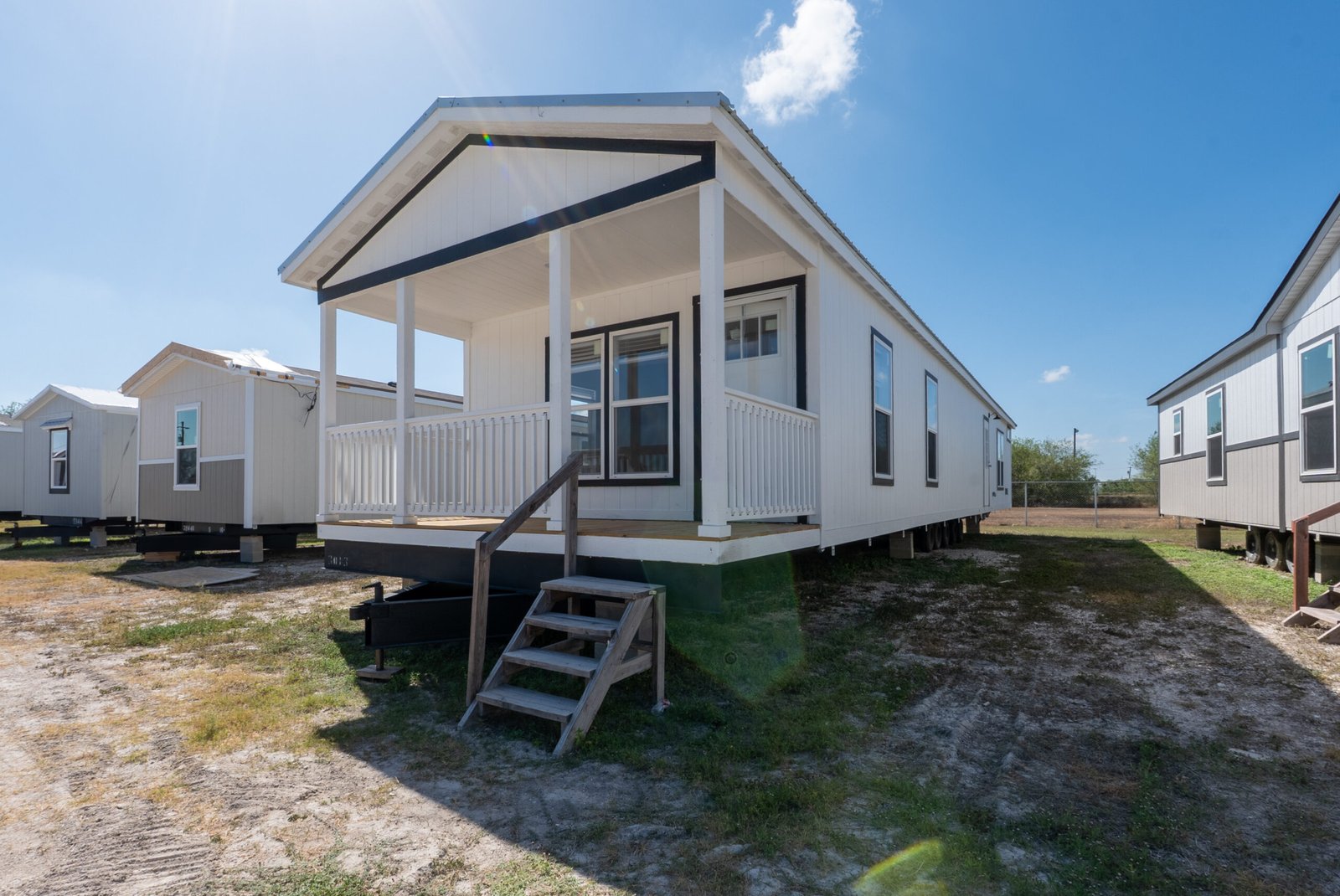 Manufactured-home exterior with raised entry steps; model example, features and finishes vary